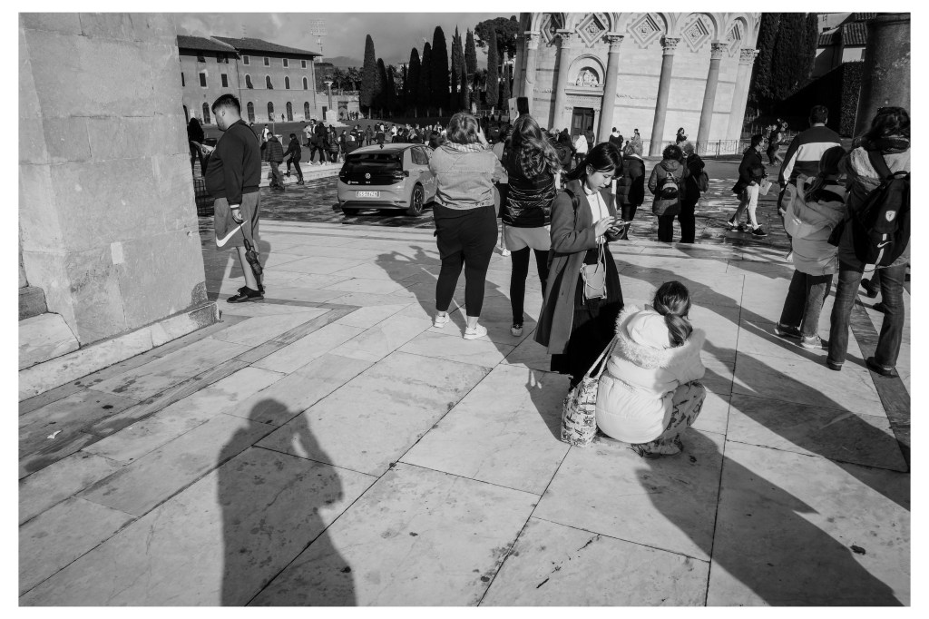 everyone taking photos of the tower in Pisa, Italy