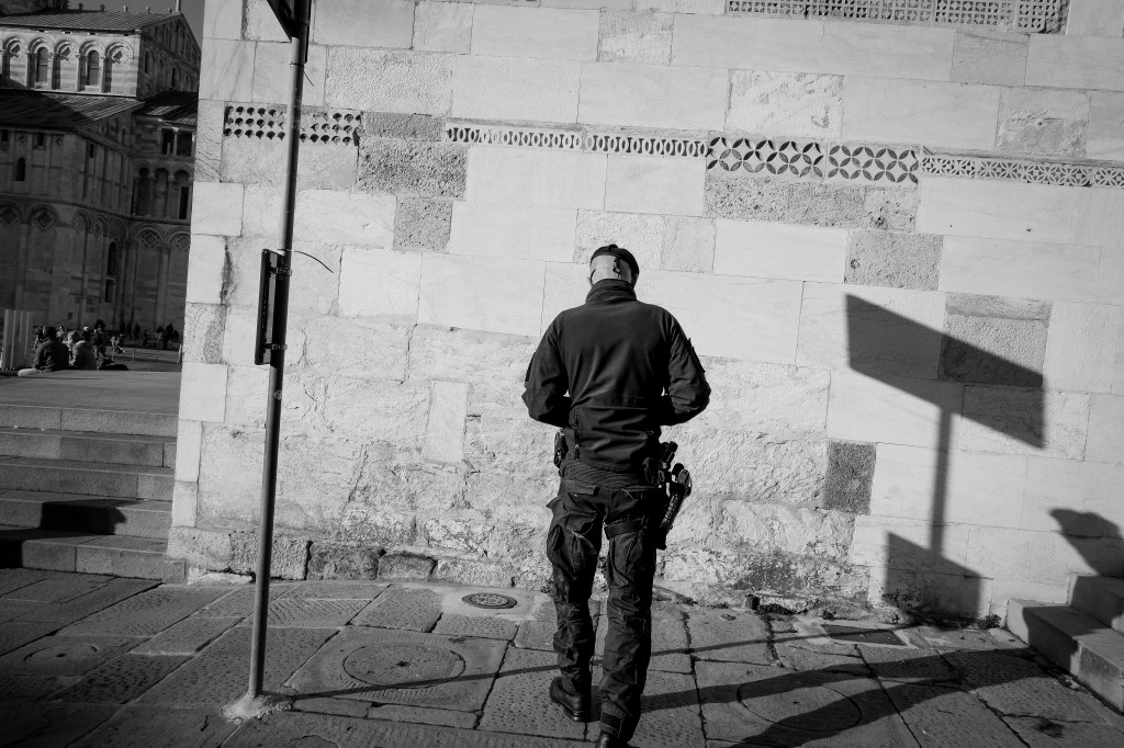 Policeman on the street in pisa, italy