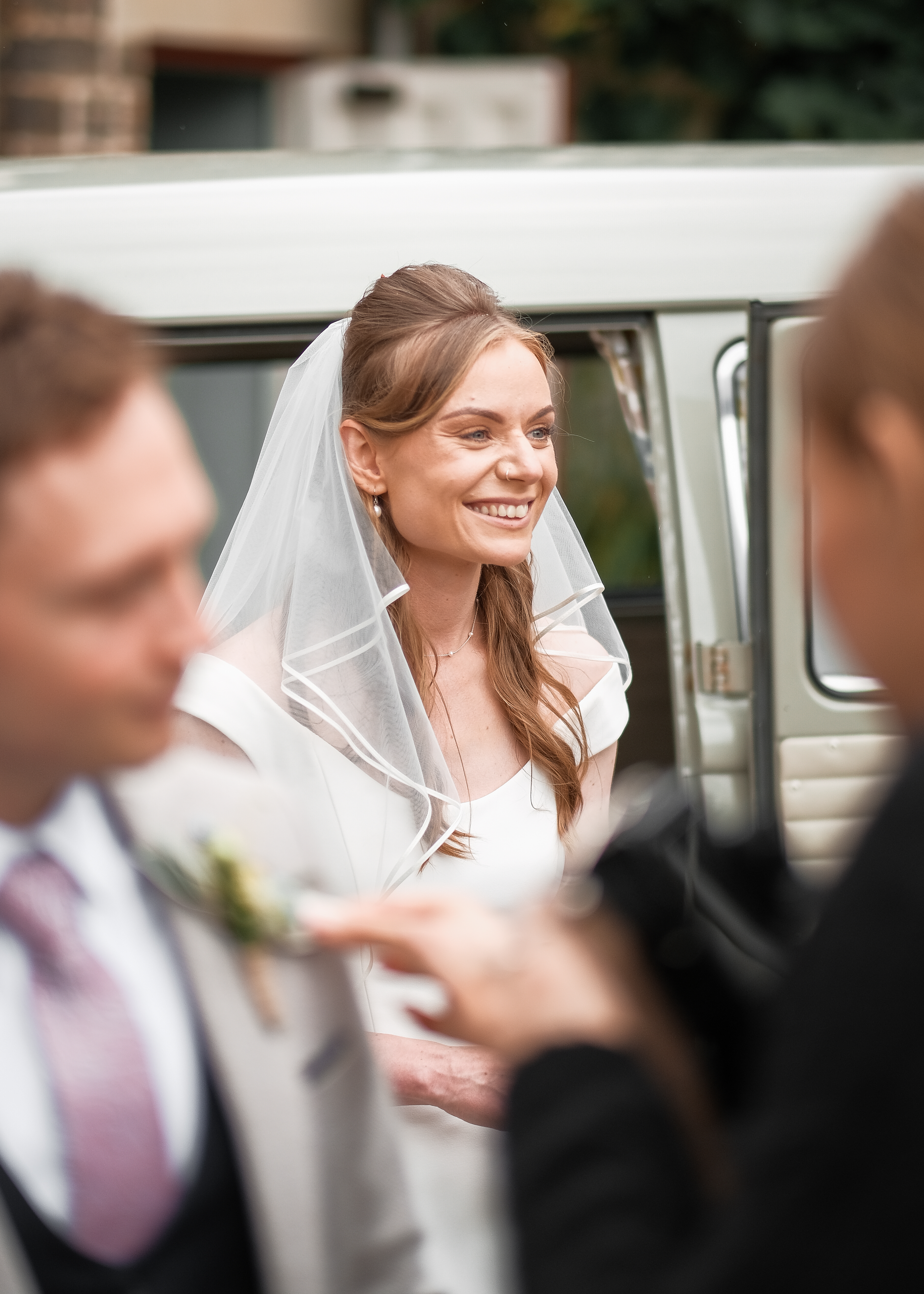 Candid smiles between wedding group photos