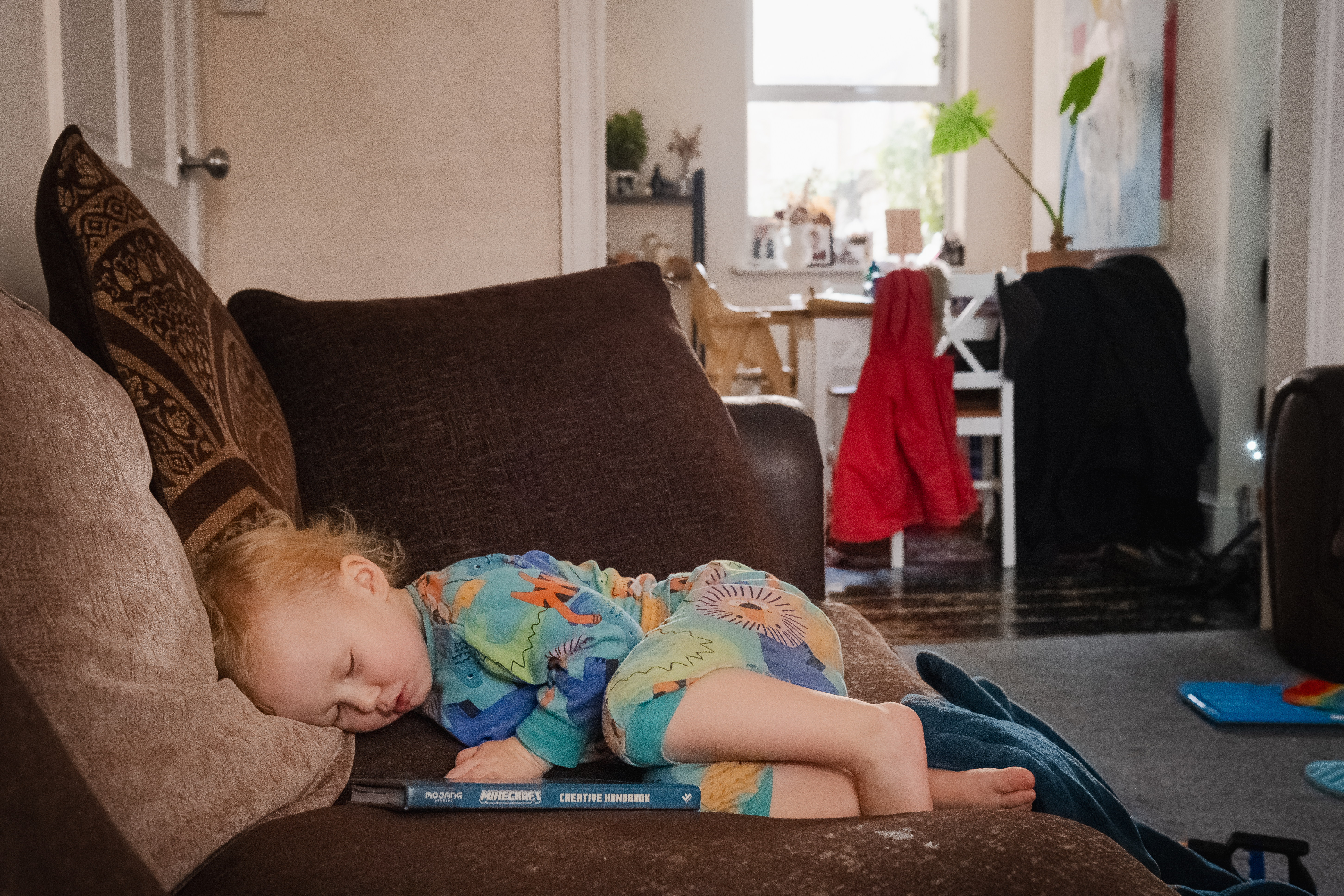 toddler asleep at home after playtime 
