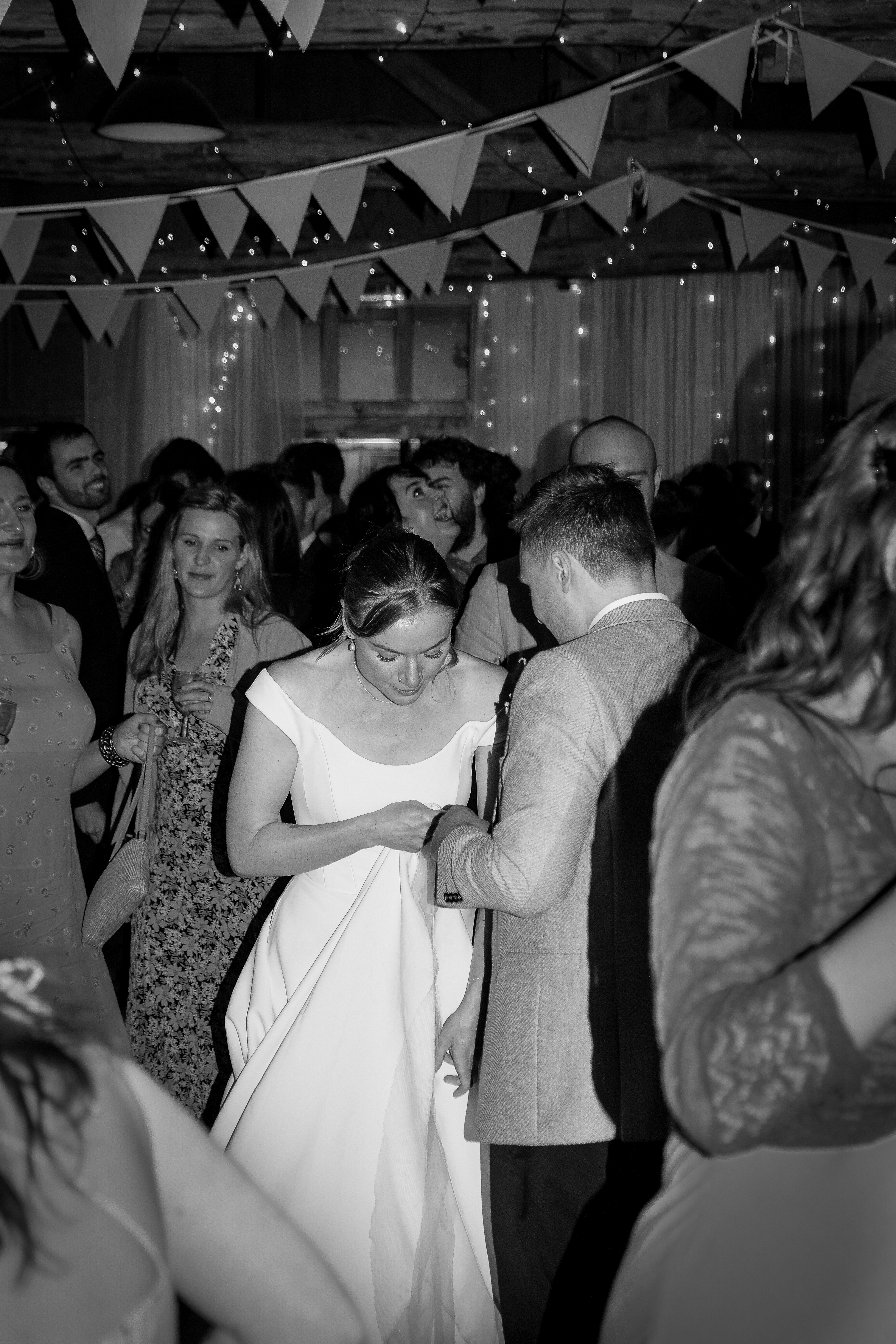 bride and groom dance at a party